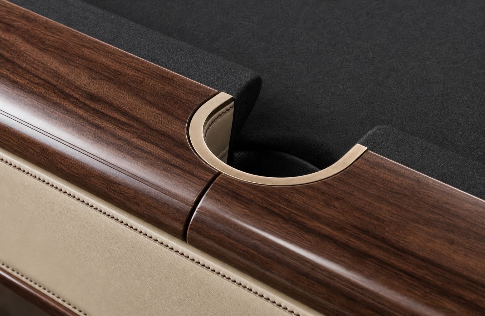 Close-up of pocket transition, wood rail, cloth, and trim