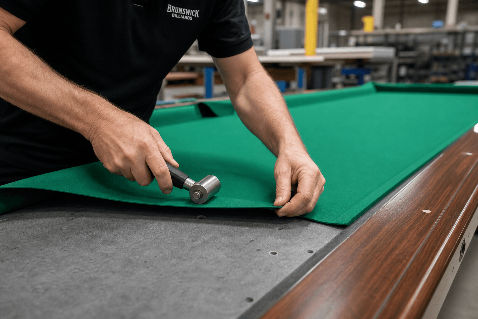 Cloth install — hand-finished playing surface.